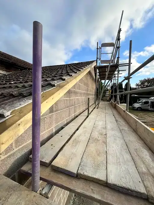 Gable rebuild and re-roof in progress with scaffolding